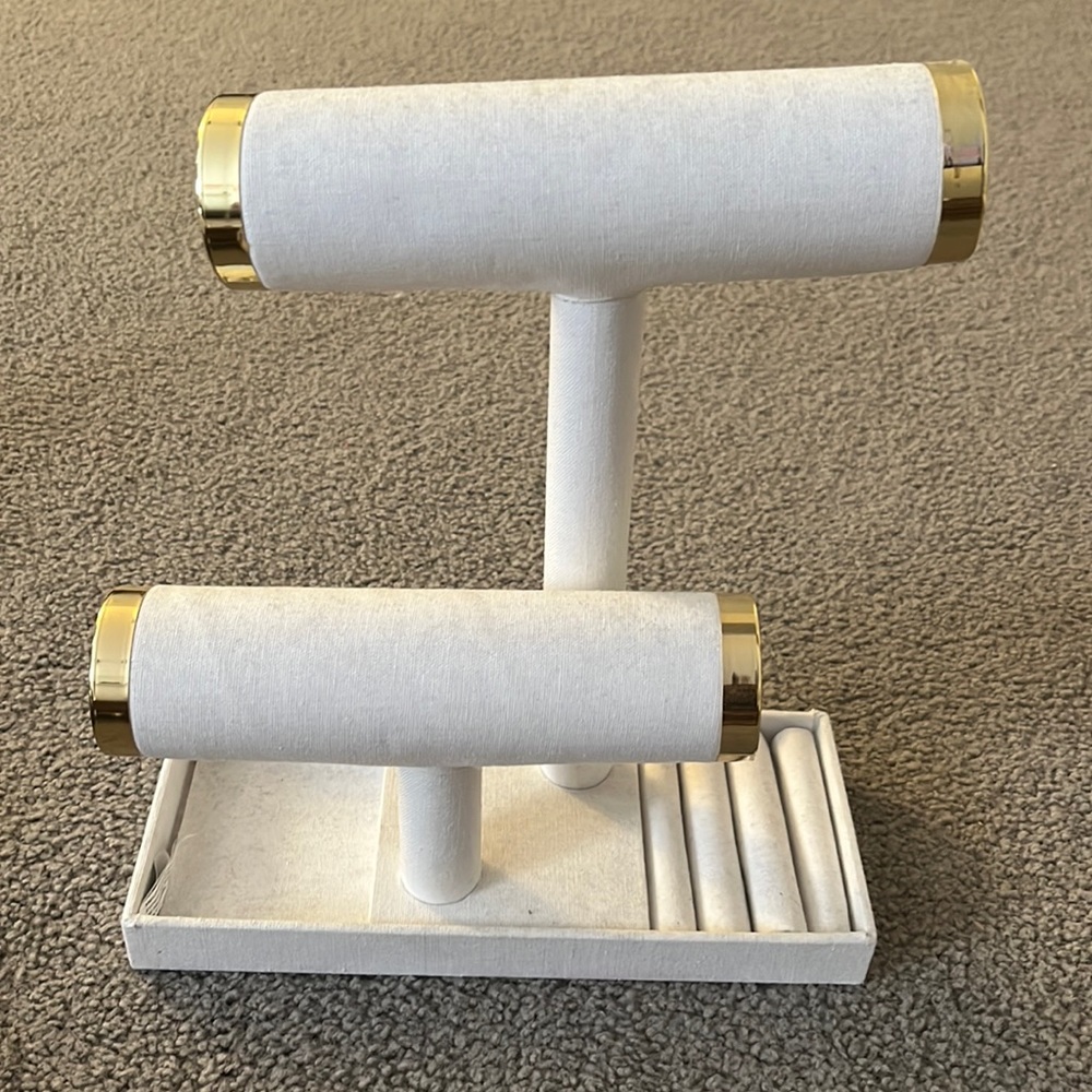 white and gold fabric jewelry holder